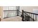 Loft area with plush carpeting and railings overlooking the main floor at 14437 Grape St, Thornton, CO 80602