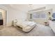 Spacious main bedroom featuring a platform bed with built-in storage and an ensuite bathroom at 14437 Grape St, Thornton, CO 80602