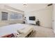 Large main bedroom showcasing a platform bed with built-in storage and a modern chandelier at 14437 Grape St, Thornton, CO 80602
