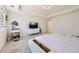 Bright main bedroom featuring a platform bed with built-in storage and a vanity at 14437 Grape St, Thornton, CO 80602