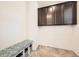 Functional mudroom with built-in bench, storage cubbies, and cabinetry at 14437 Grape St, Thornton, CO 80602