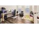 Comfortable home office featuring hardwood floors and natural light at 14437 Grape St, Thornton, CO 80602