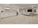 Spacious finished basement with custom cabinets and a stylish seating area at 6248 S Coventry Ln, Littleton, CO 80123