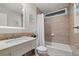 Cozy bathroom featuring tile details and a combination tub and shower at 6248 S Coventry Ln, Littleton, CO 80123