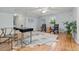This bedroom boasts hardwood floors, neutral paint, two chairs, and a desk by the window at 6248 S Coventry Ln, Littleton, CO 80123