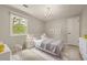 Charming bedroom with a decorative chandelier and large window at 6248 S Coventry Ln, Littleton, CO 80123