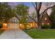Charming brick home with a well-manicured lawn, mature trees, and a two-car garage providing great curb appeal at 6248 S Coventry Ln, Littleton, CO 80123