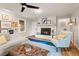 Cozy living room with painted brick fireplace, hardwood floors, and stylish decor at 6248 S Coventry Ln, Littleton, CO 80123