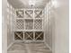 Wine room showcases tile floors, custom wood cabinetry, geometric shapes, and recessed lighting at 6248 S Coventry Ln, Littleton, CO 80123