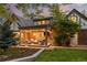 Inviting covered outdoor patio with comfortable seating, a fire pit, and stylish decor at 6248 S Coventry W Ln, Littleton, CO 80123