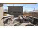 Backyard patio showcasing a fire pit, outdoor kitchen, and stylish seating area at 872 S Vine St, Denver, CO 80209