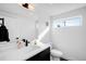 Modern bathroom featuring sleek fixtures, a floating vanity, and a bright window at 872 S Vine St, Denver, CO 80209