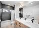 Bathroom features a double sink vanity and tiled shower at 872 S Vine St, Denver, CO 80209