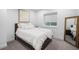 Cozy bedroom with a comfortable bed, soft linens, and natural light through the window at 872 S Vine St, Denver, CO 80209
