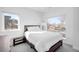 This bright bedroom features large windows and a simple bed at 872 S Vine St, Denver, CO 80209