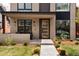 Close up view of a modern front door featuring a glass pane design and stylish hardware at 872 S Vine St, Denver, CO 80209