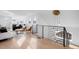 Open-concept living area with hardwood floors, high ceilings, and modern lighting at 872 S Vine St, Denver, CO 80209
