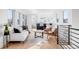 Bright living room with comfortable seating, stylish decor, and open to the kitchen at 872 S Vine St, Denver, CO 80209