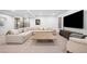 Spacious living room features neutral tones, large sectional, and entertainment center at 872 S Vine St, Denver, CO 80209