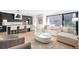 Bright open-concept living area with modern furnishings and a large sliding glass door at 872 S Vine St, Denver, CO 80209