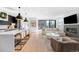 Open living space with gourmet kitchen, living area, and natural light at 872 S Vine St, Denver, CO 80209