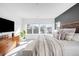 Main bedroom with large windows, wood furniture, and ample natural light at 872 S Vine St, Denver, CO 80209