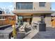 Outdoor patio with a built-in grill, fire pit, and seating; perfect for entertaining at 872 S Vine St, Denver, CO 80209
