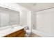 Bathroom featuring a vanity, toilet, and a shower-tub combo at 4896 S Dudley St # 8-11, Littleton, CO 80123