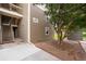 Side view of condo building with exterior staircase and building number display at 4896 S Dudley St # 8-11, Littleton, CO 80123