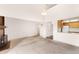 Open-concept living room featuring a fireplace and bright natural light at 4896 S Dudley St # 8-11, Littleton, CO 80123