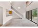 Open floorplan living room with staircase and sliding doors to balcony at 4896 S Dudley St # 8-11, Littleton, CO 80123