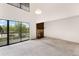 Bright living room boasts a fireplace and large glass patio doors at 4896 S Dudley St # 8-11, Littleton, CO 80123