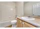 Bathroom featuring a toilet, bathtub/shower combo, and a vanity sink with light wood cabinets at 16051 E Geddes Dr # 66, Aurora, CO 80016