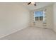 Bedroom featuring carpeted floors, a ceiling fan, and window with natural light at 16051 E Geddes Dr # 66, Aurora, CO 80016
