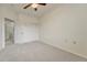 Carpeted bedroom with neutral colors, a ceiling fan, and closet at 16051 E Geddes Dr # 66, Aurora, CO 80016