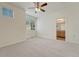 Bright bedroom with a ceiling fan, large windows with blinds and carpeted floors at 16051 E Geddes Dr # 66, Aurora, CO 80016