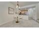 Cozy dining area with a round table, chandelier, and an adjacent open kitchen at 16051 E Geddes Dr # 66, Aurora, CO 80016