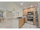 Bright, functional kitchen with stainless appliances and adjacent dining area at 16051 E Geddes Dr # 66, Aurora, CO 80016