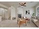 Open concept living room featuring a fireplace, comfortable sofa, and neutral decor, creating a welcoming atmosphere at 16051 E Geddes Dr # 66, Aurora, CO 80016