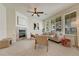 Spacious living room with a fireplace, modern décor, ample natural light, and comfortable seating at 16051 E Geddes Dr # 66, Aurora, CO 80016