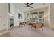 Bright living room featuring a fireplace, large windows, and comfortable seating, perfect for relaxing and entertaining at 16051 E Geddes Dr # 66, Aurora, CO 80016