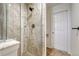Modern shower stall with glass door and gray tile at 16051 E Geddes Dr # 66, Aurora, CO 80016