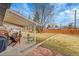 Inviting backyard featuring a covered patio, green lawn, and wood fence for privacy at 365 W Peakview Ave, Littleton, CO 80120