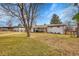 Spacious backyard with a well-maintained lawn and a covered patio, perfect for outdoor living at 365 W Peakview Ave, Littleton, CO 80120