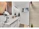 Bright bathroom with white countertops, modern fixtures, and a large mirror for a clean design at 365 W Peakview Ave, Littleton, CO 80120