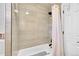 Bathroom with shower/tub combination featuring neutral tile and modern fixtures for a functional design at 365 W Peakview Ave, Littleton, CO 80120