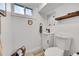 Bright bathroom with a modern vanity, toilet, and decorative accents at 365 W Peakview Ave, Littleton, CO 80120