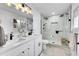 Modern bathroom with double vanity, walk-in shower, and stylish lighting for a spa-like retreat at 365 W Peakview Ave, Littleton, CO 80120