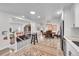 Bright dining area featuring wood floors, a colorful rug, and stylish decor for inviting meals at 365 W Peakview Ave, Littleton, CO 80120