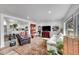 Bright and airy living room with hardwood floors, neutral tones, and modern furnishings; perfect for entertaining at 365 W Peakview Ave, Littleton, CO 80120